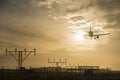 Airplane landing at dusk Royalty Free Stock Photo