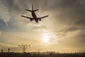 Airplane landing at dusk. Royalty Free Stock Photo