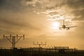 Airplane landing at dusk. Royalty Free Stock Photo