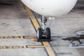 Airplane landing gear wheel parking on ground Royalty Free Stock Photo