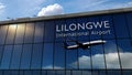 Airplane landing at Lilongwe Malawi airport mirrored in terminal