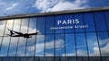 Airplane landing at Paris France mirrored in terminal Royalty Free Stock Photo