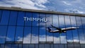 Airplane landing at Paro Thimphu Bhutan airport mirrored in terminal