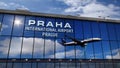 Airplane landing at Praha, Prague mirrored in terminal