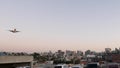 Airplane landing, San Diego airport California USA. Plane arriving, city skyline Royalty Free Stock Photo