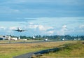 Airplane landing and take-off sequence-merged in one photo Royalty Free Stock Photo