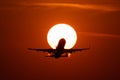 Airplane landing or takeoff in the sunset with red sky in Bucharest international airport , Plain spotting