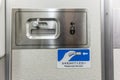 The airplane lavatory door lock with english and japanese instructions Royalty Free Stock Photo