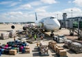 Airplane loading cargo at airport terminal Royalty Free Stock Photo
