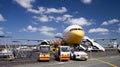 Airplane loading cargo. Royalty Free Stock Photo