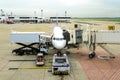 Airplane maintenance checking during refueling and loading baggage Royalty Free Stock Photo