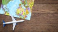 Airplane and world map wooden table background. concept travel. Empty space for text - booking a flight ticket Royalty Free Stock Photo