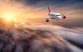 Airplane mith motion blur effect is flying over low clouds Royalty Free Stock Photo