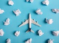Airplane model flying among paper clouds. Royalty Free Stock Photo