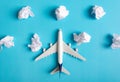 Airplane model flying among paper clouds. Royalty Free Stock Photo