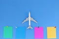 Airplane model with stick paper note on blue background with copy space.Preparation for Traveling and tour concept Royalty Free Stock Photo