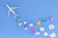 Airplane model with various paper ball on blue background with Royalty Free Stock Photo
