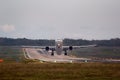 Airplane moments after takeoff, leaving runway behind Royalty Free Stock Photo