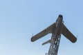 Airplane - monument. Soviet plane with red star against blue sky.