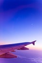 Airplane and moon on gradient colors sky
