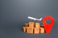 Airplane over cardboard boxes and red position location pin. Delivery services of consignments and cargoes by air. Parcels