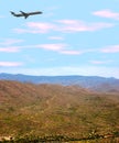 Airplane Over Desert Royalty Free Stock Photo