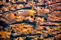 Airplane over desert during sunset in Middle East Royalty Free Stock Photo