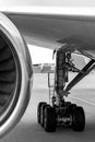 Airplane parked at airport. aircraft engine and chassis Royalty Free Stock Photo