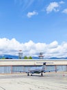 Airplane parked with radar towers over the hangar Royalty Free Stock Photo