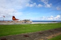 The airplane is on the parking apron beside the sea in Lanyu, Taiwan. Royalty Free Stock Photo