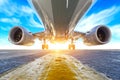 Airplane in the parking lot of the airport apron, bottom view hdr of engines, fuselage and wings. Against the background of the sk Royalty Free Stock Photo