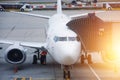 Airplane passenger gangway of the terminal building at the airport, aircraft flight maintenance