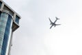 A plane flying over a house -background Royalty Free Stock Photo