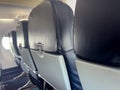 Airplane passenger seats in cabin interior during flight Royalty Free Stock Photo
