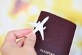 Airplane and passport in hand flight travel traveller fly travelling citizenship air boarding pass travel business trip Royalty Free Stock Photo