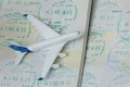 Airplane on passport pages with a visa. Close up Royalty Free Stock Photo