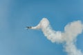 Airplane performing at airshow and shows a stunt