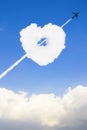 The airplane pierce through the clouds shape of heart.