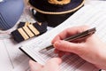 Airplane pilot filling in flight plan Royalty Free Stock Photo