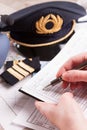 Airplane pilot filling in flight plan Royalty Free Stock Photo
