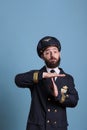 Airplane pilot showing time out gesture with hands