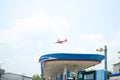 Airplane preparing for landing at Don Mueang International Airport over the cityin Thailand