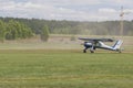 Airplane PZL 104 Wilga on Takeoff and Landing Strip In Front of Spectators