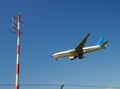 Airplane and radio mast Royalty Free Stock Photo