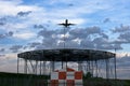 Airplane ready to land in sunset colors Royalty Free Stock Photo