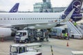 Airplane refueling at an airport Royalty Free Stock Photo