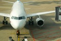 Airplane refueling connected fuel hose under the fuel tank. Refueling of the airplane before flight Royalty Free Stock Photo