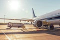 Airplane refueling, connected fuel hose under the fuel tank in the wing Royalty Free Stock Photo