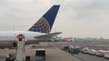 Airplane refueling before take-off.Service staff converse on the