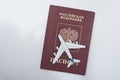 Airplane on the russian passport. Travel concept. White background Royalty Free Stock Photo